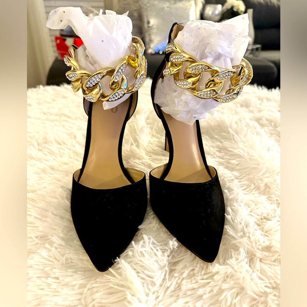 Women’s size 9 black pumps with gold chain ankle straps.